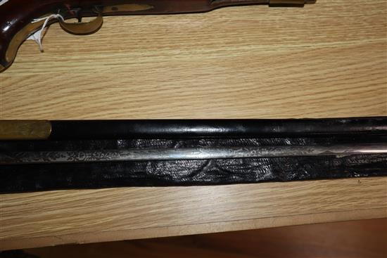 A Court sword having gilt metal hilt and etched blade, with frog, leather scabbard and outer case